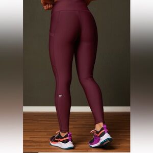 Fabletics Cold Weather High-Waisted Pocket Leggings in Merlot Size L